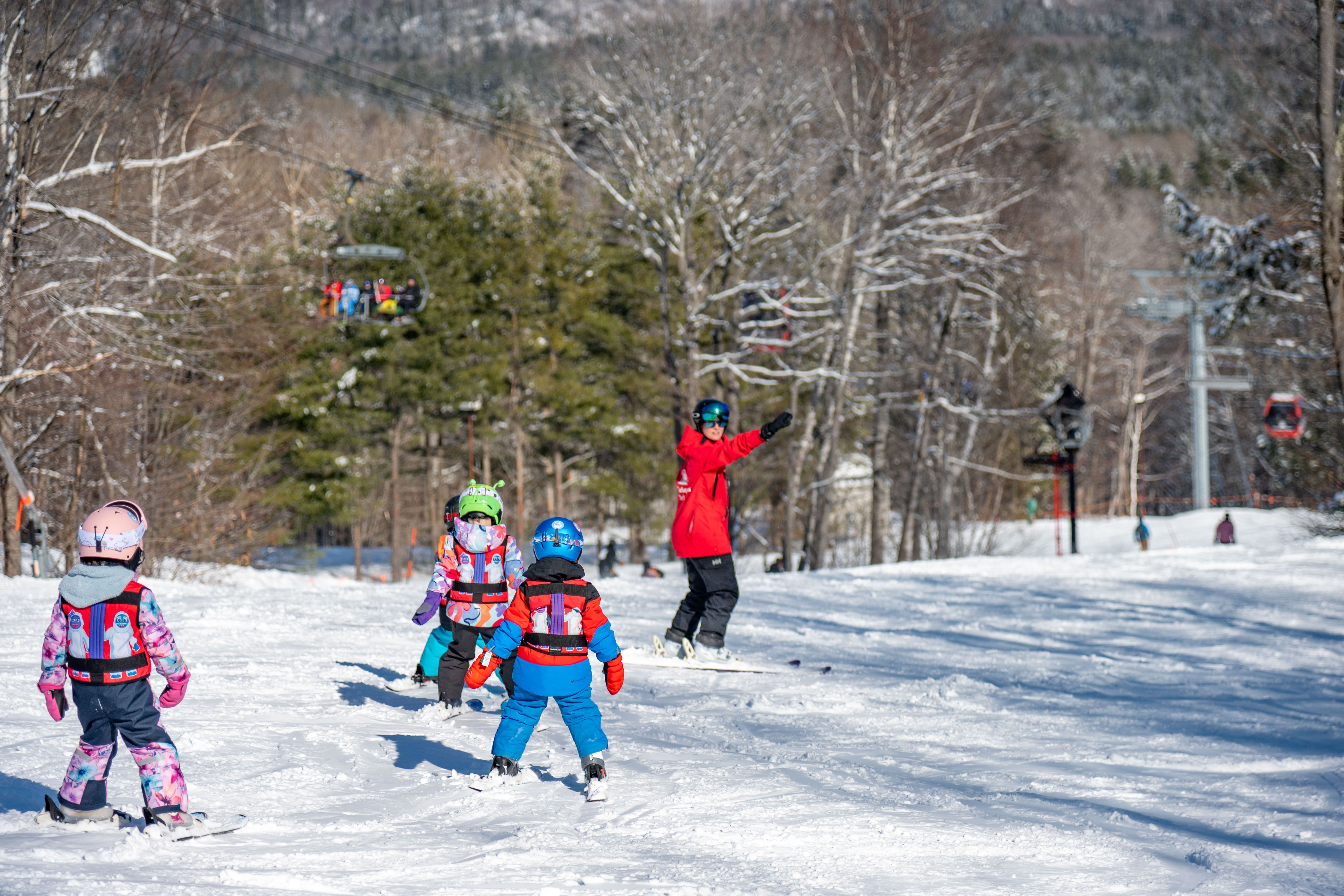 A little kid taking a lesson at Sunday River.