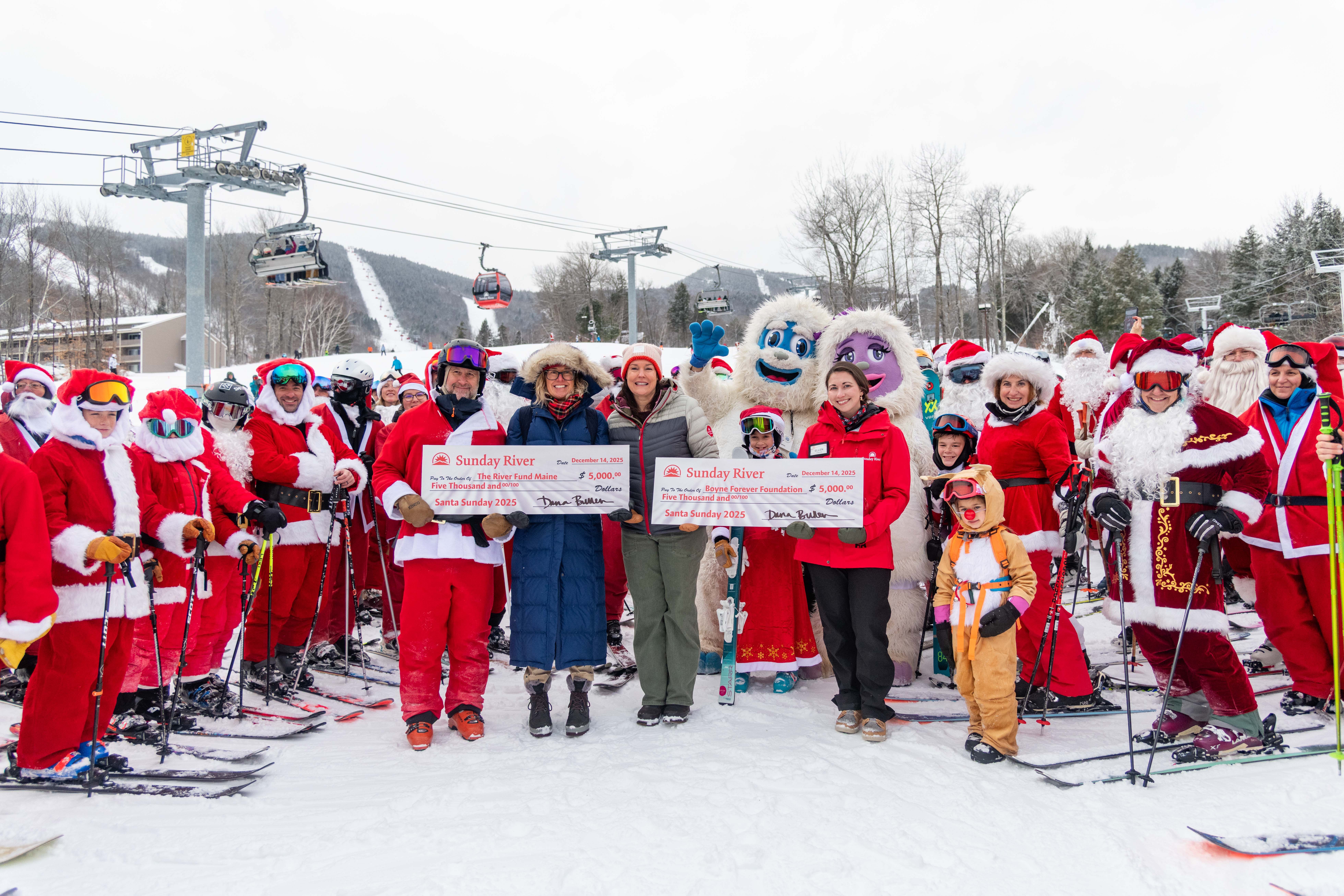 People posing for a picture at a check presentation at Santa Sunday.