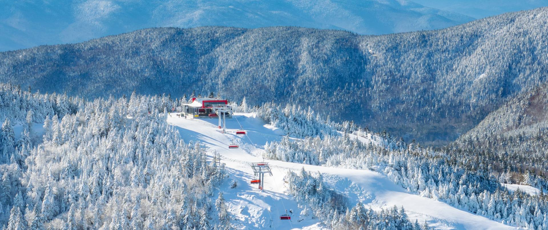 The Jordan 8 in the winter with mountains in the background at Sunday River.