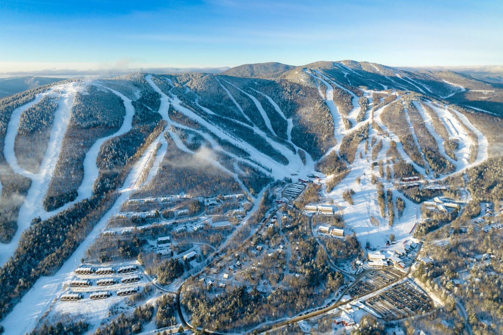 An aerial photo of Sunday River Resort in the winter, with all 8 peaks.