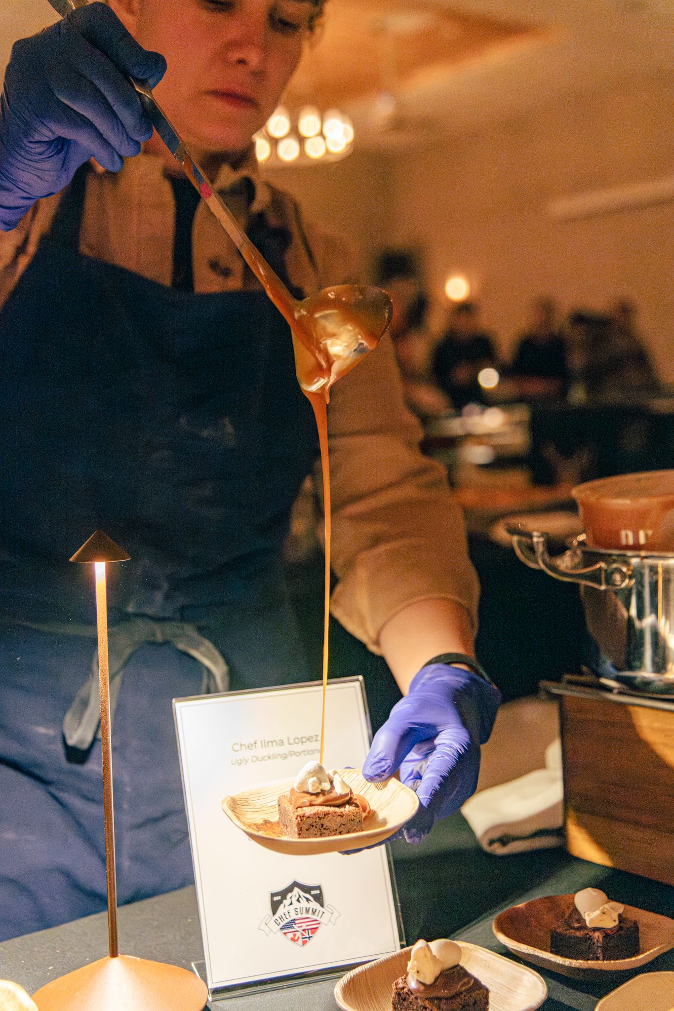 A chef preparing a sample at the Chef Summit at Sunday River.