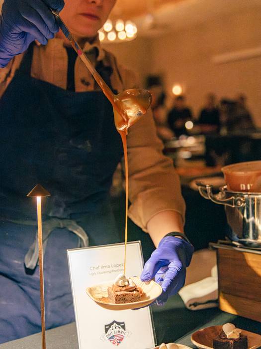 A chef preparing a sample at the Chef Summit at Sunday River.
