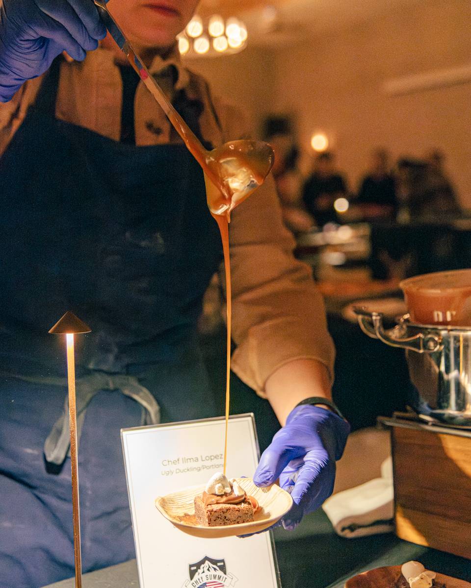A chef preparing a sample at the Chef Summit at Sunday River.