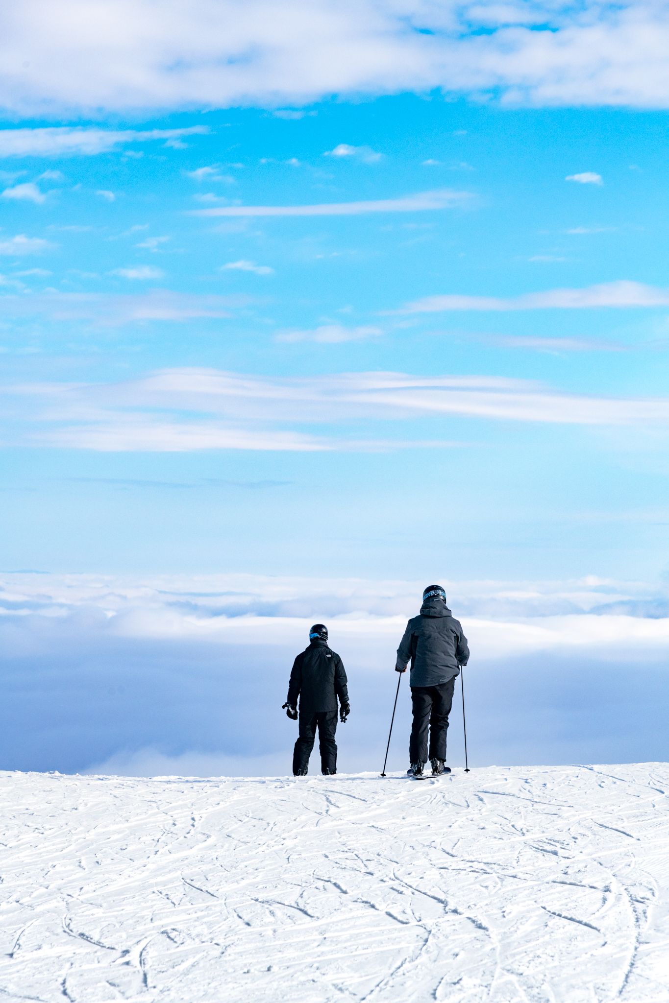 Skiers looking at the undercast at Sunday River.