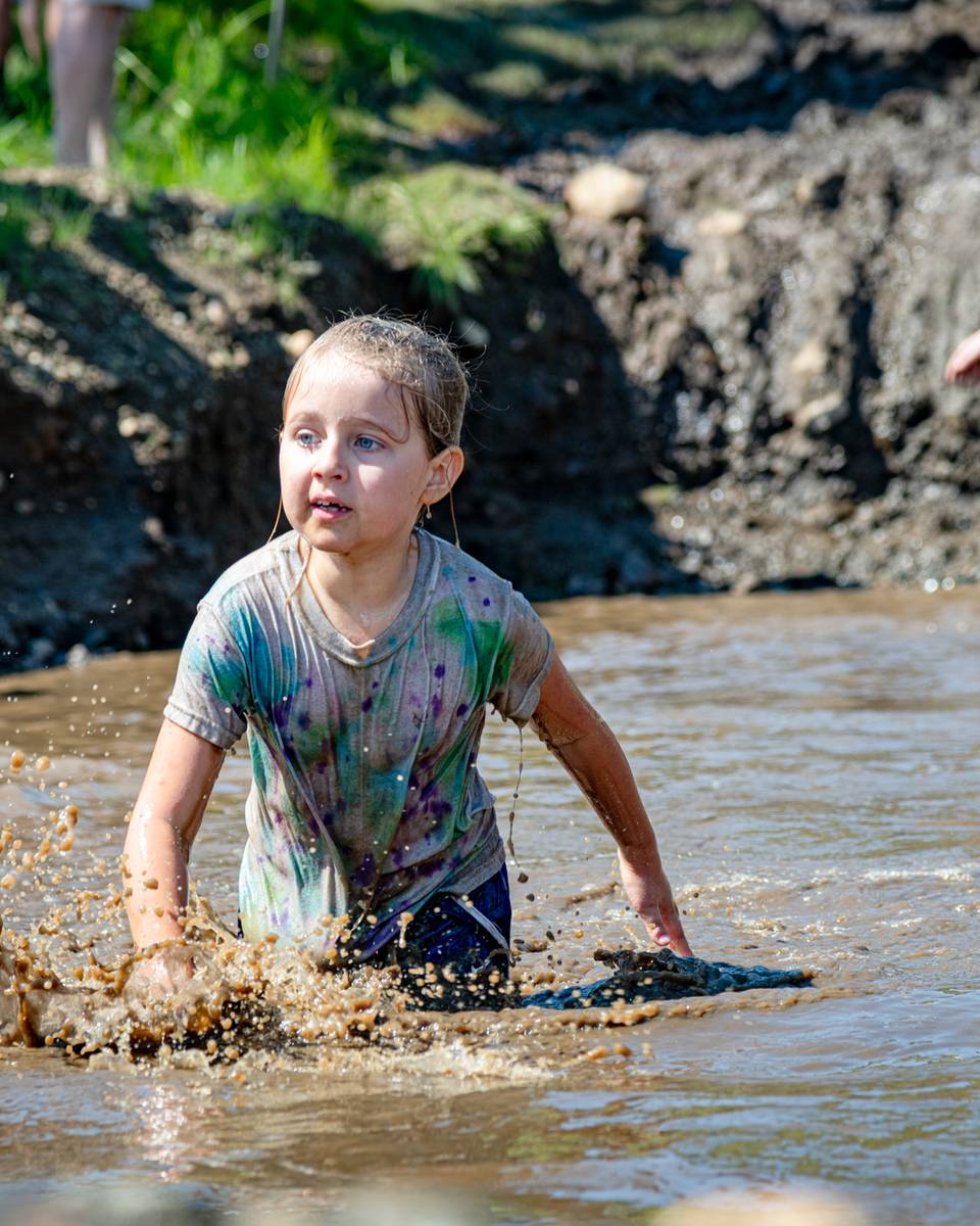 Kids walking through the mud pit at the Mini Mountain Challenge at Sunday River.
