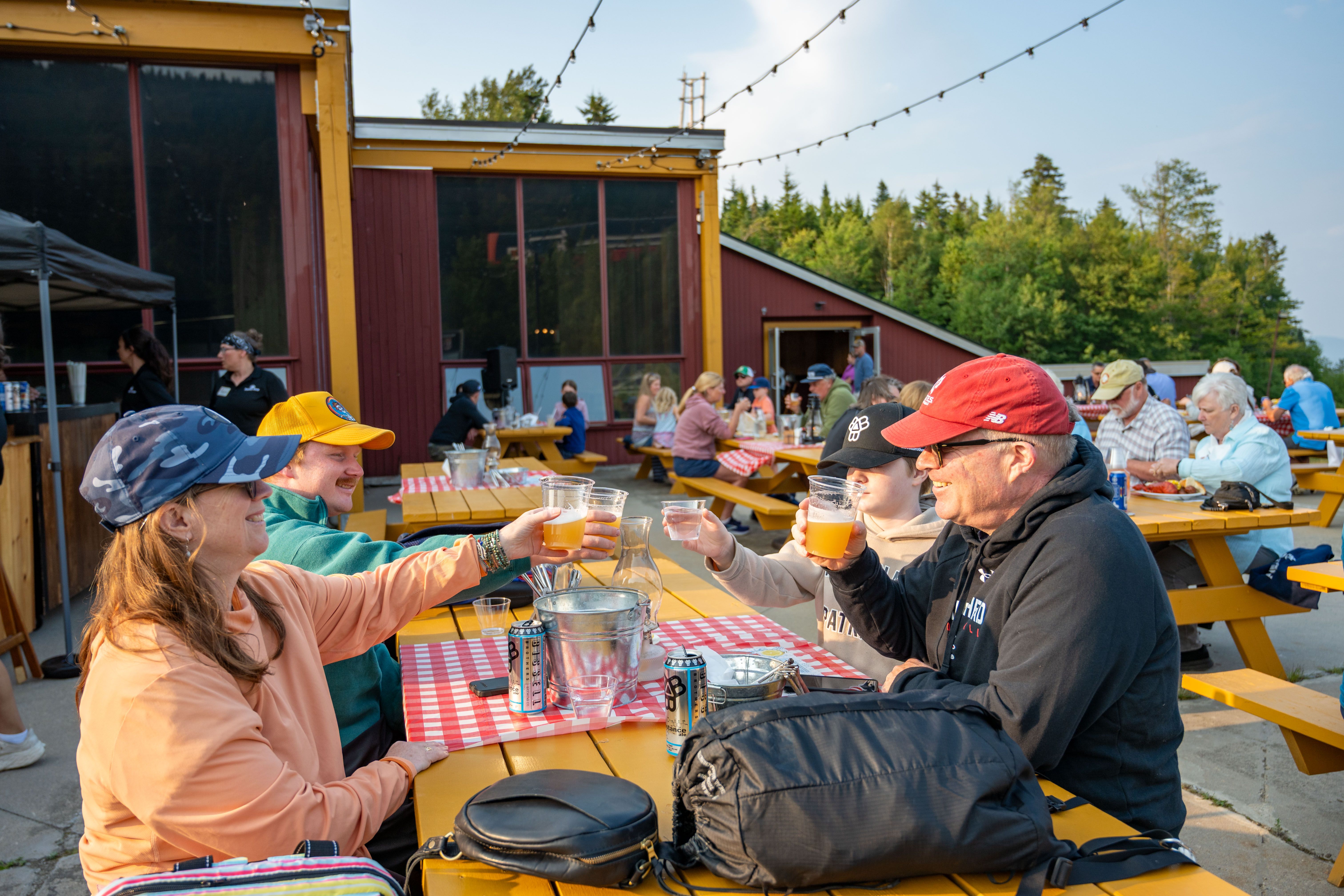 People sitting and enjoying the lobster bake at Sunday River.