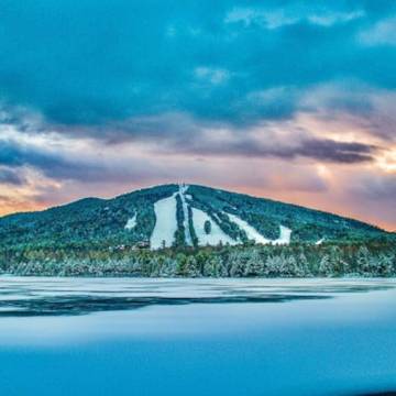 Pleasant Mountain, Maine in the winter at sunset.