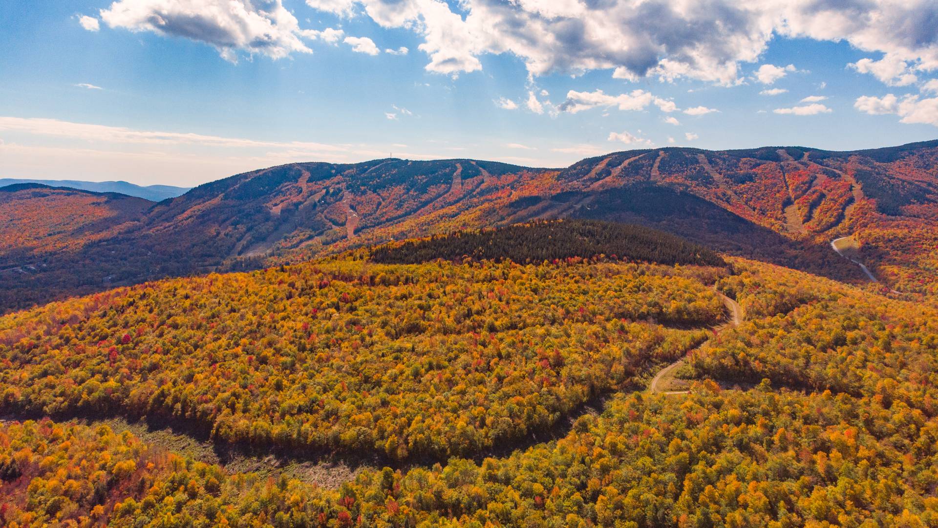 Merrill Hill with Sunday River Resort in the background in the fall.