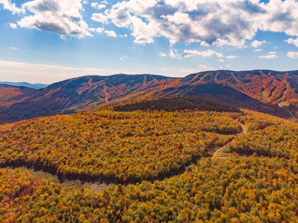 Fall foliage out in the Jordan bowl overlooking the Jordan Hotel at Sunday River Resort in Newry, Maine