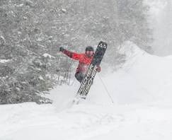 A skier in powder at Sunday River, Maine