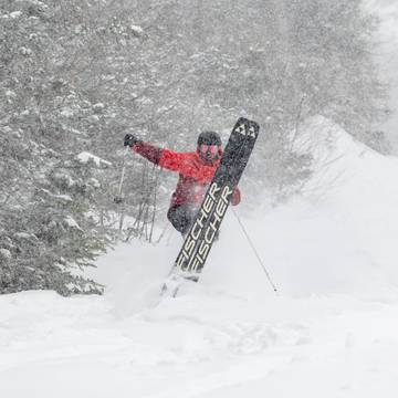 A skier in powder at Sunday River, Maine