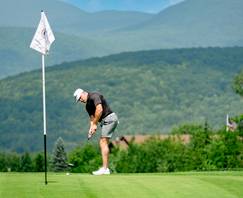 A person putting at Sunday River Golf Club.