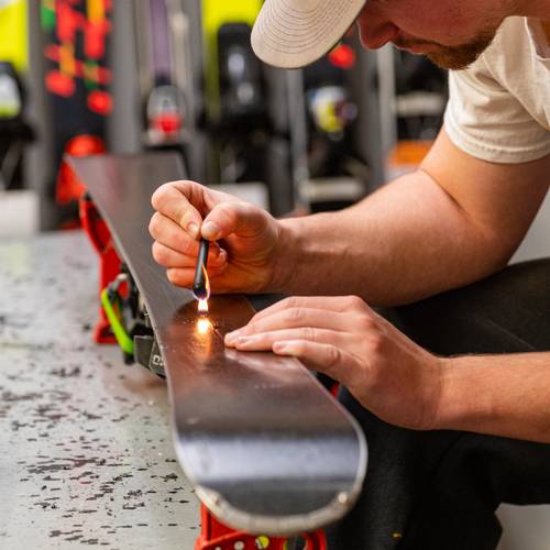 A guy repairing skis at Sunday River.