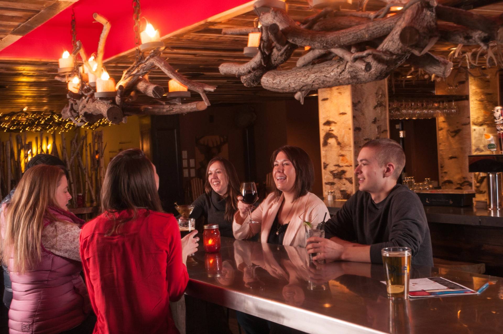 A group having drinks at the bar at Camp.