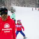 A little girl taking a lesson at Sunday River.