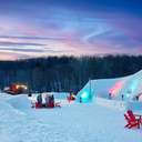 The Iglu at Sunday River with colorful lights at night.
