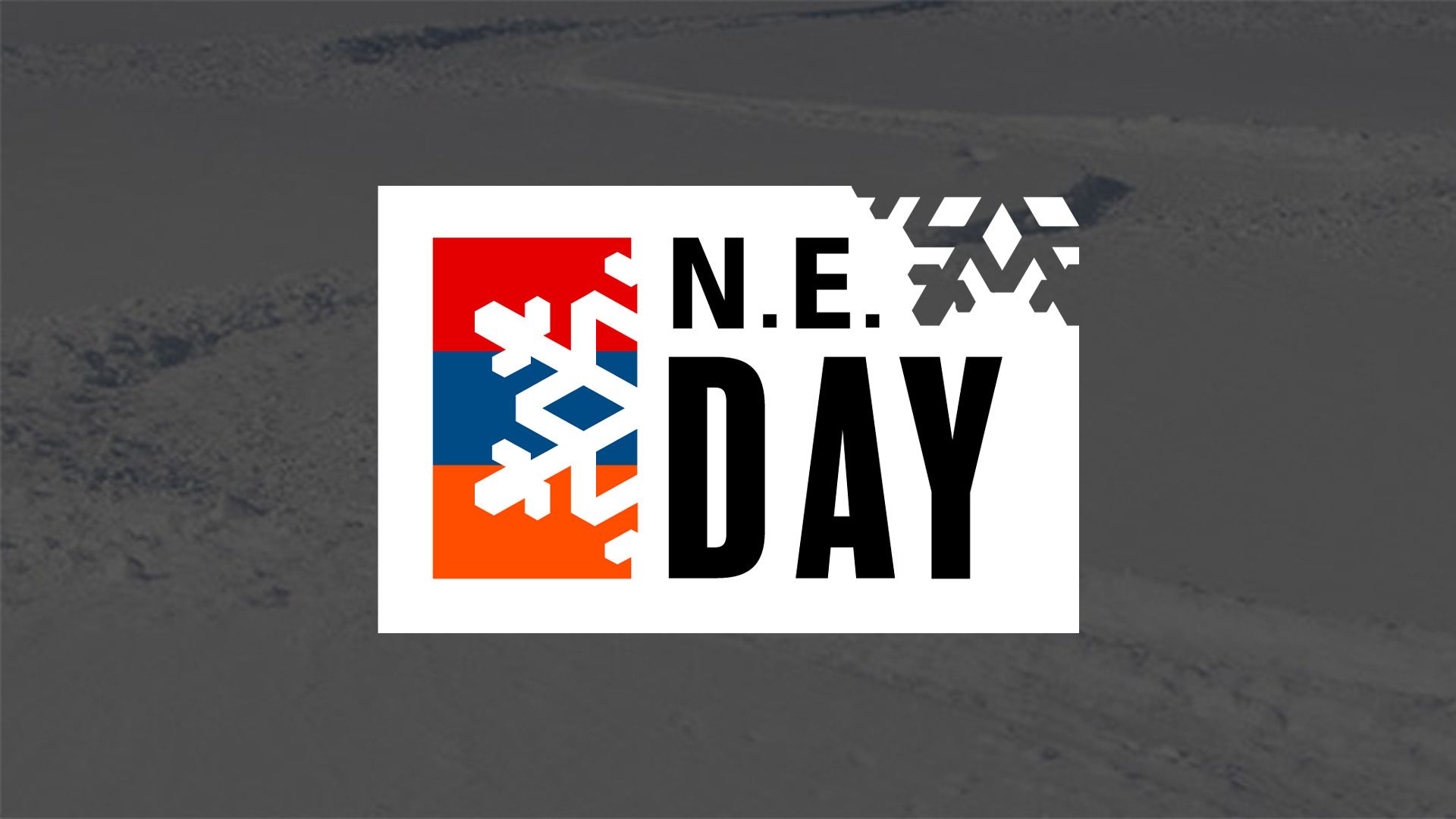 NE Day logo over fresh snow