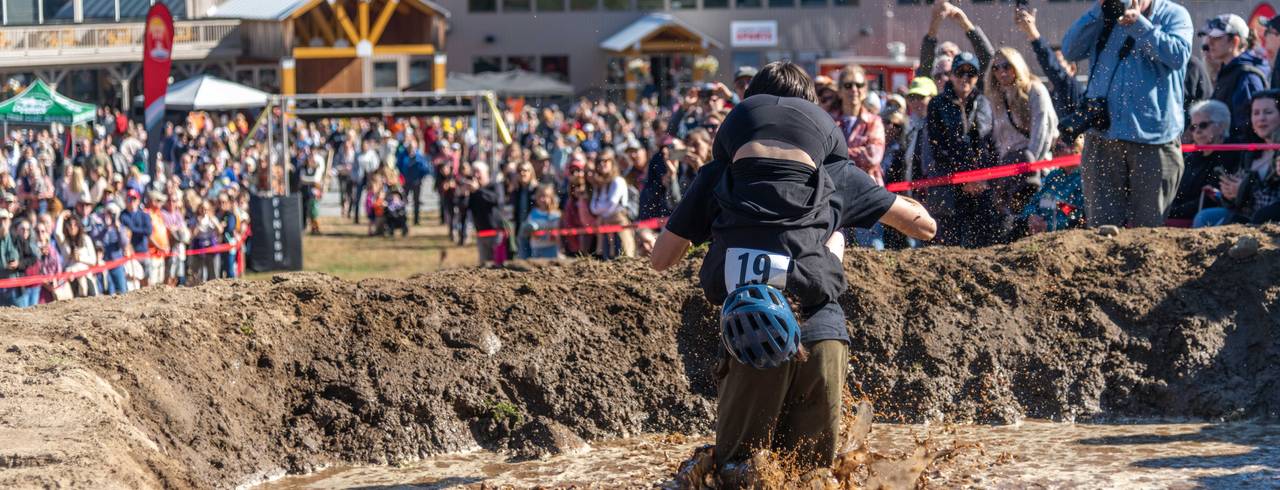 A couple participating in the North American Wife Carrying competition at Sunday River.