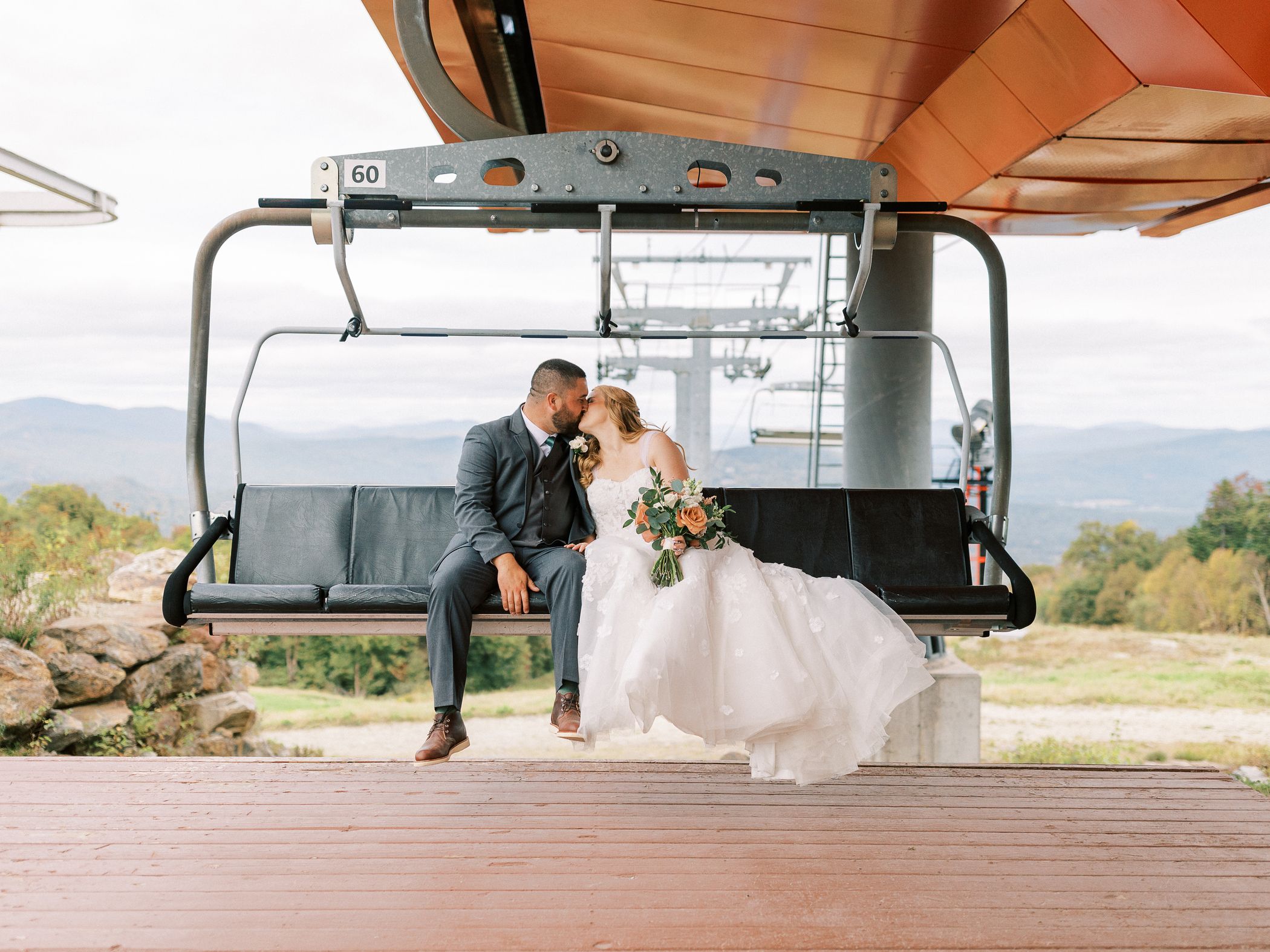 People kissing on a chairlift chair at Sunday River.