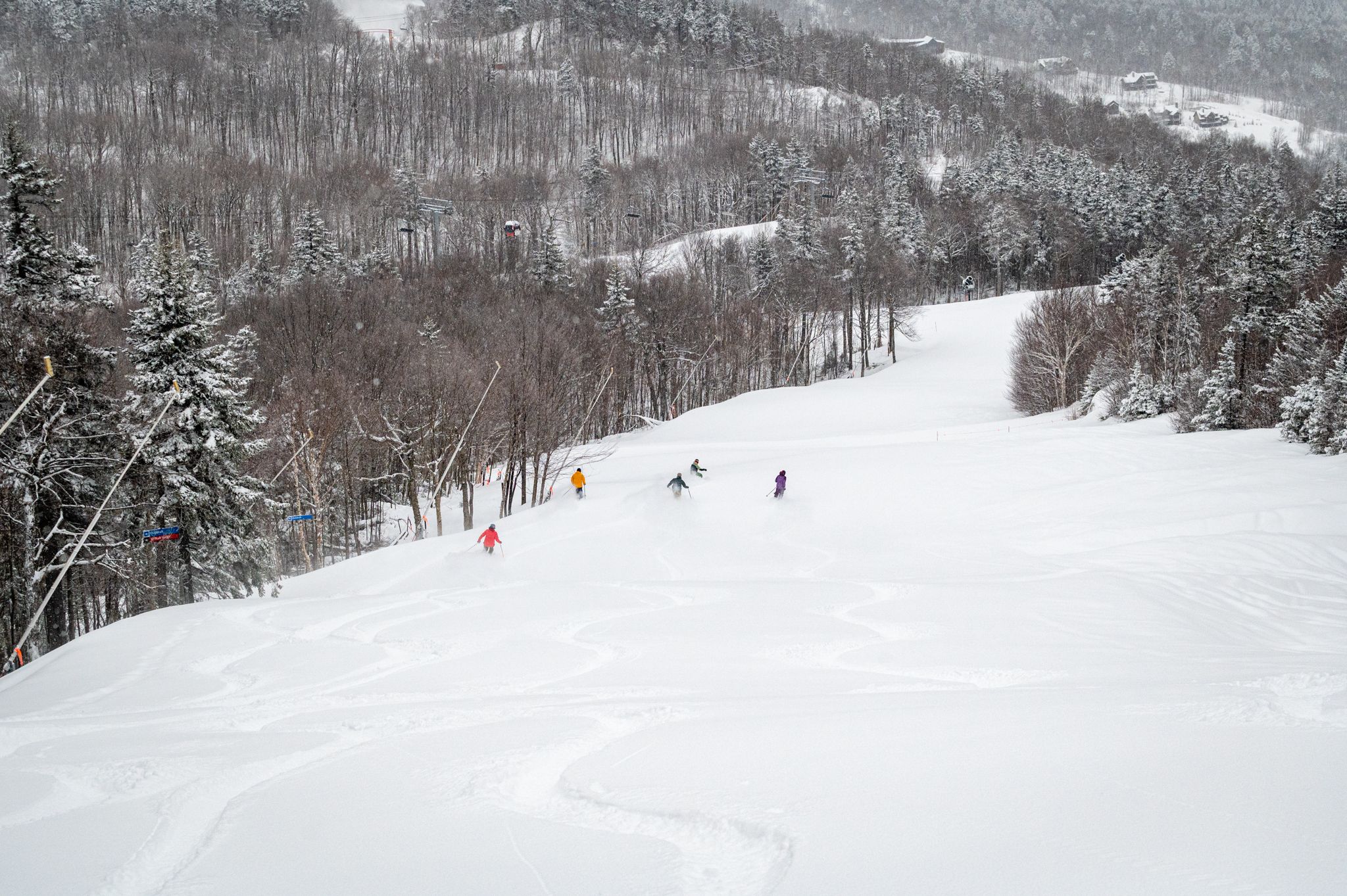 Skiers in a group on a powder day.