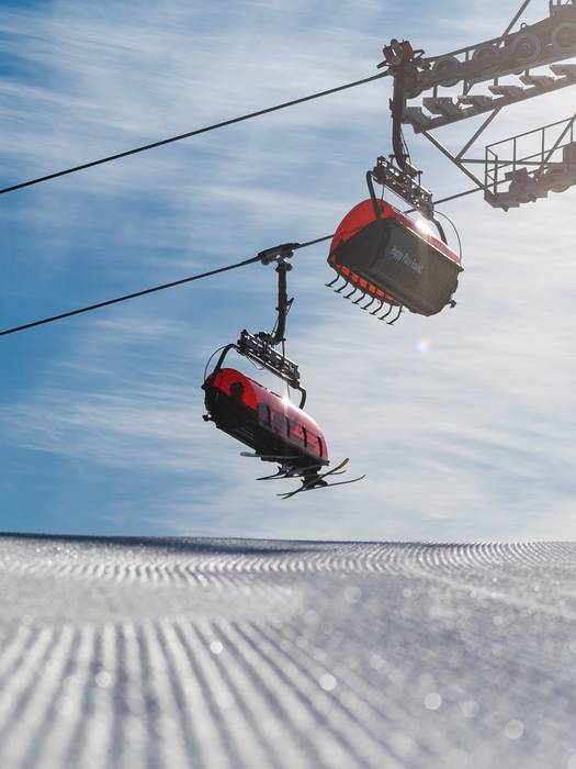 The Jordan 8 chairs with skiers riding up.