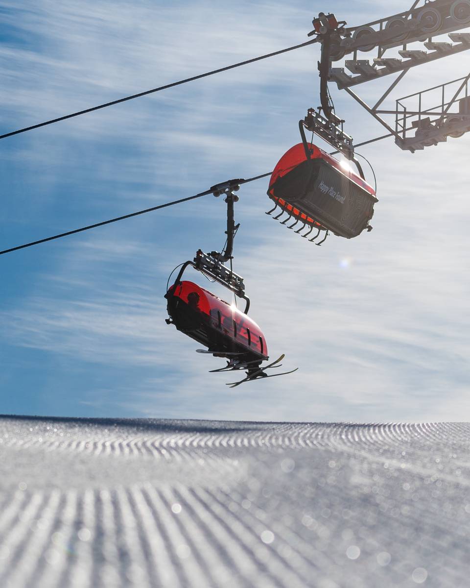 The Jordan 8 chairs with skiers riding up.