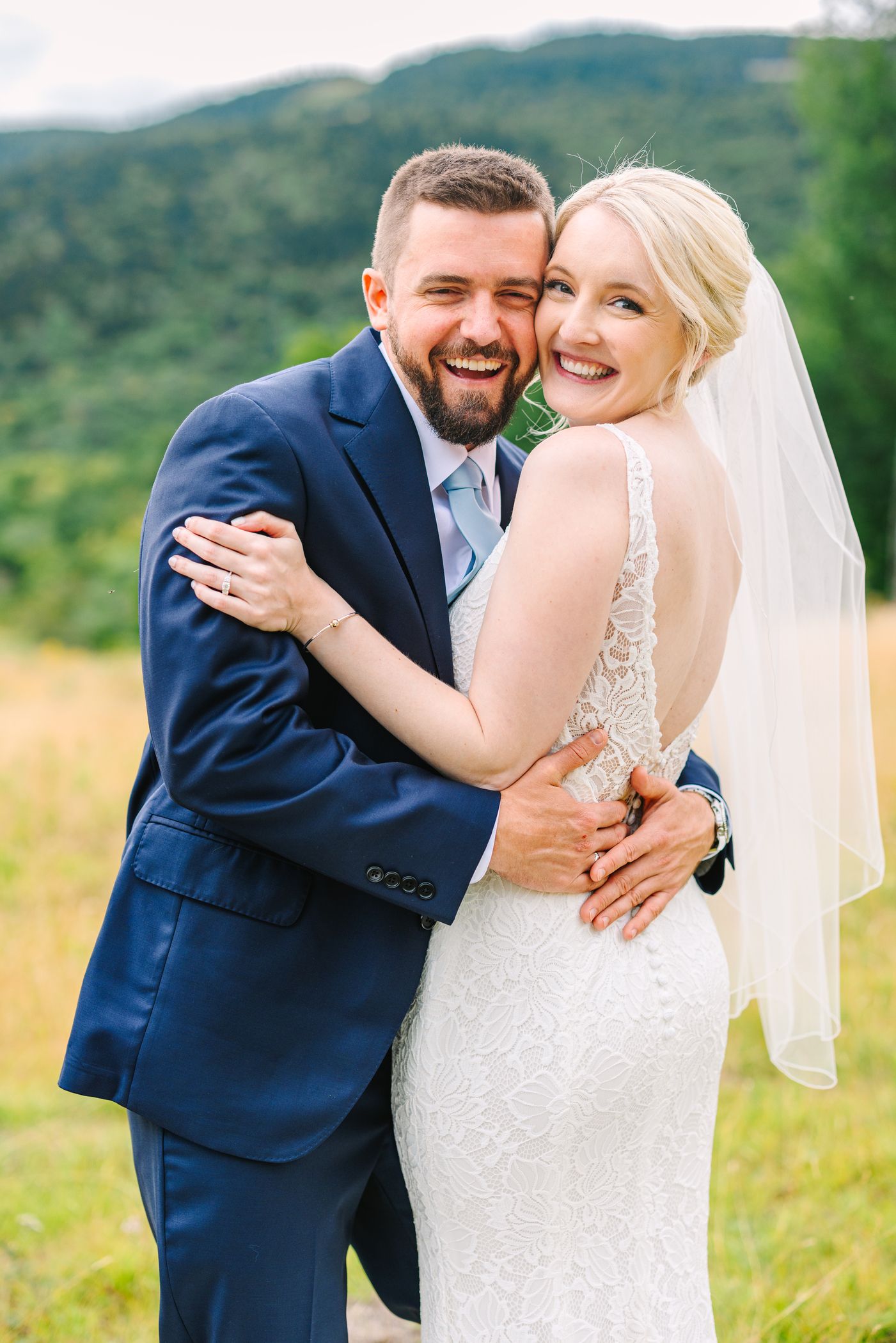 A bride and groom smiling after getting married at Sunday River.