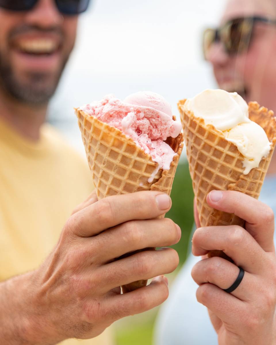 A man and a woman pose with their ice creams at Sunday River.