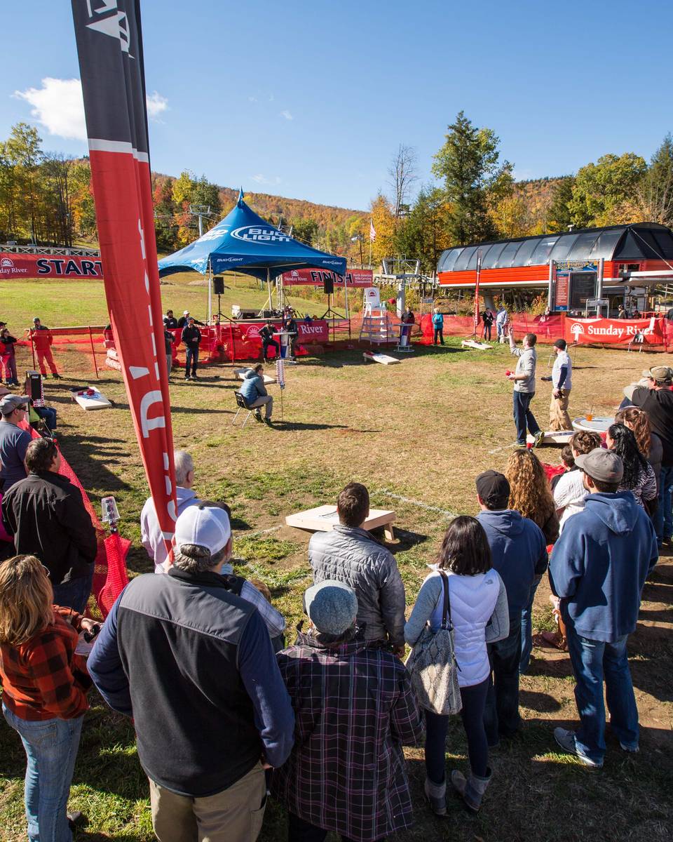 Spectators watching the cornhole tournament.