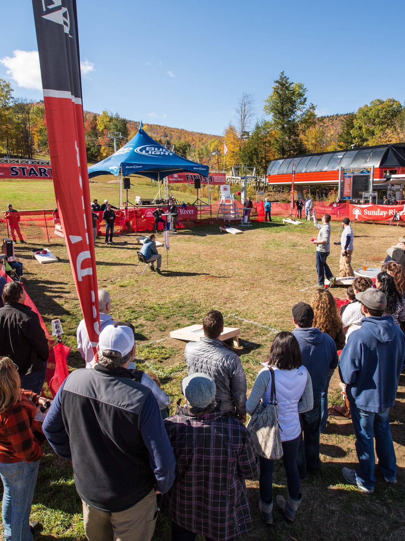 People standing and having beers under a tent at Maine Brew Fest at Sunday River.