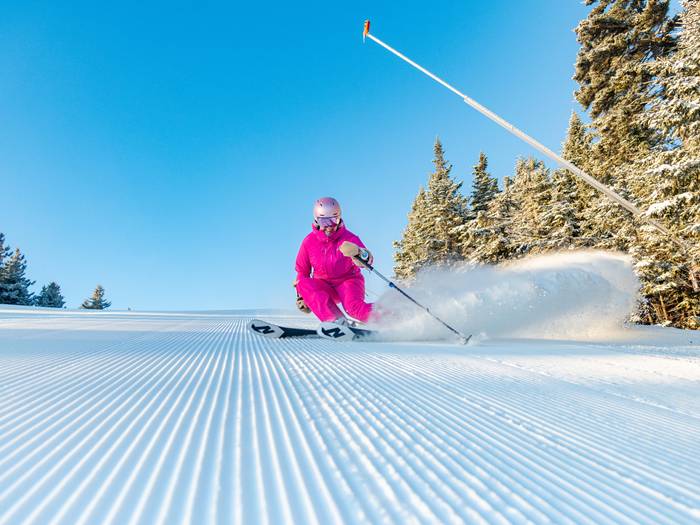 A woman skiing at Sunday River.