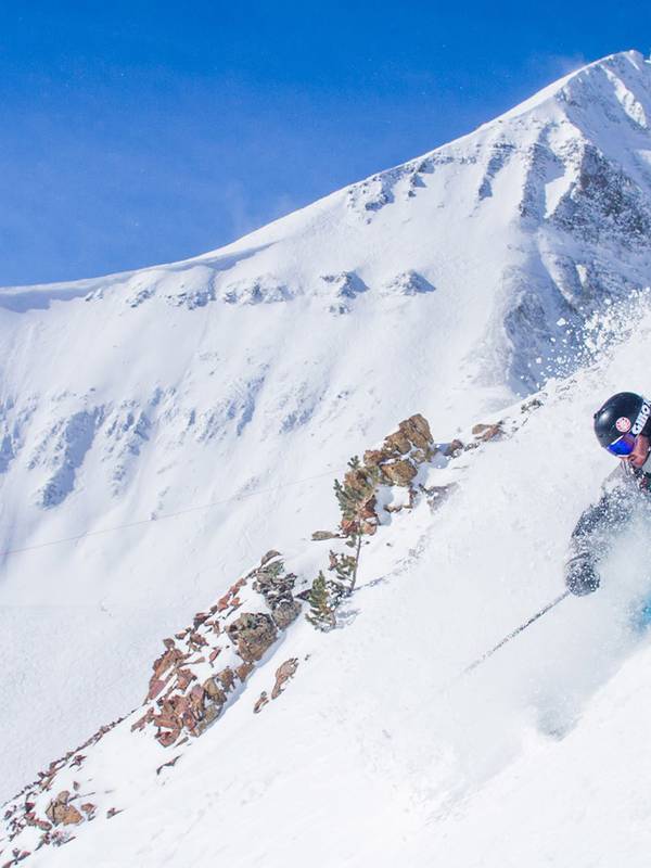 A skier shredding down a trail at Big Sky.