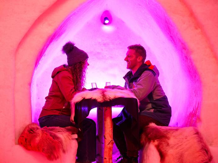 Two people sitting and enjoying a drink in The Igloo.