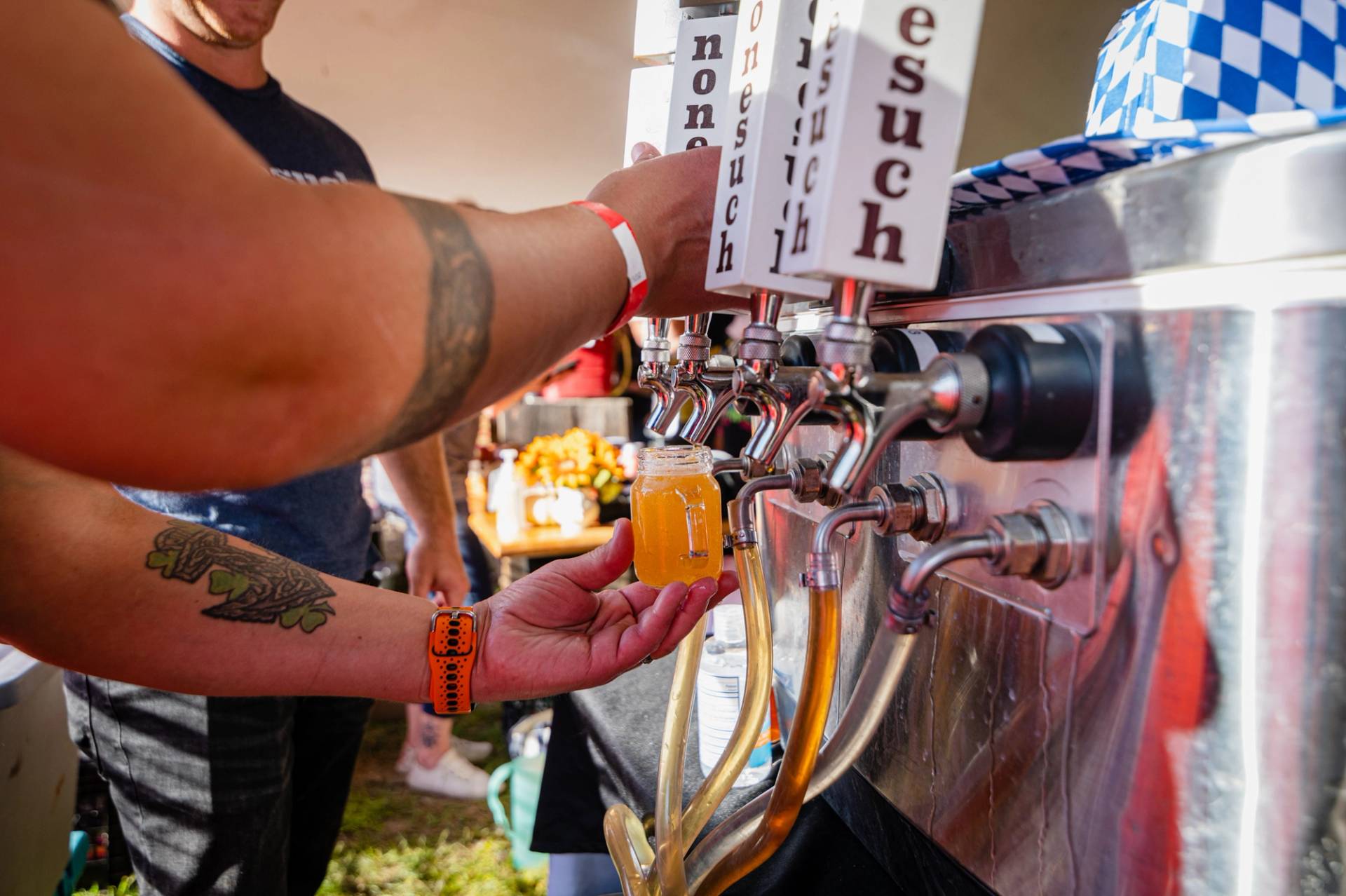A person pouring some beer at Maine Brew Fest at Sunday River.