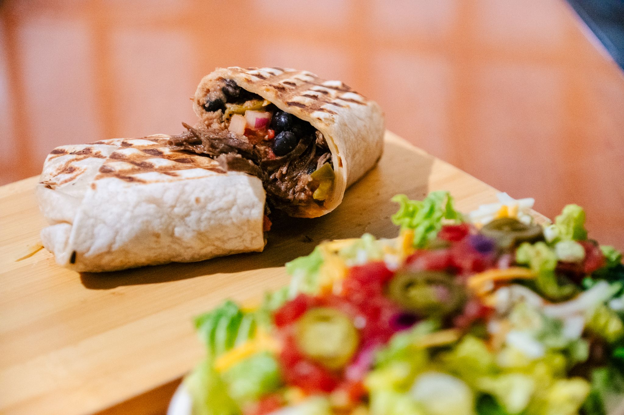 A burrito and salad from Cilantro Burrito.