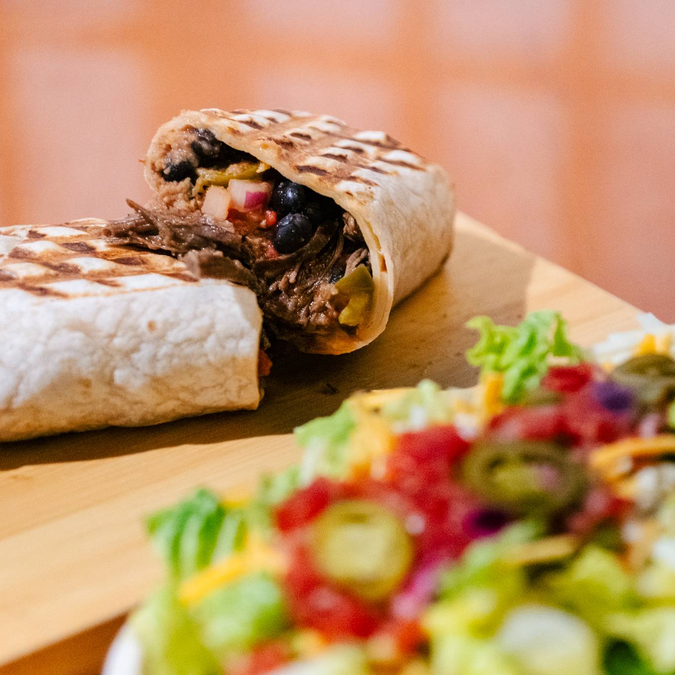 A burrito and a salad.