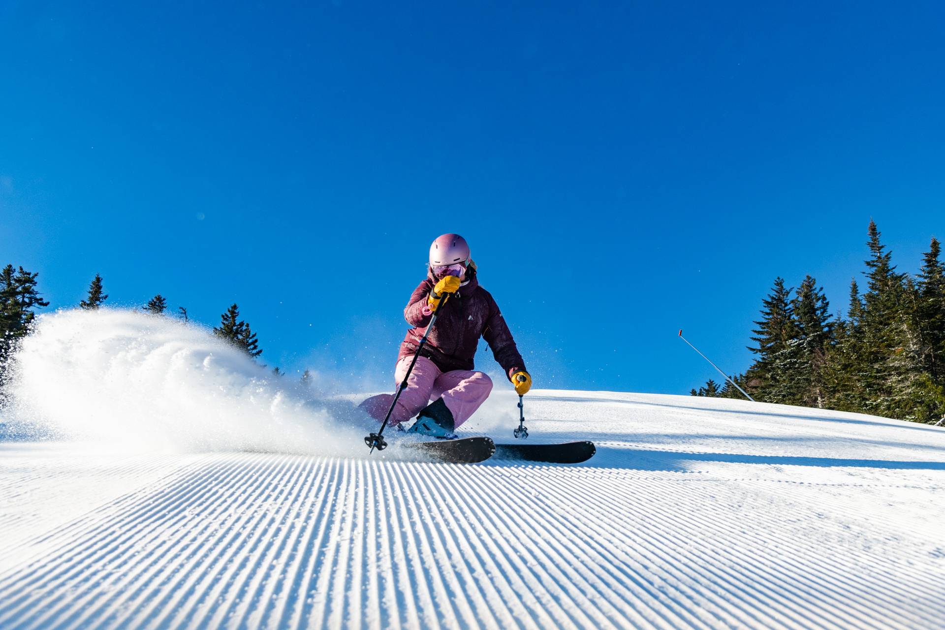 A skier shredding at Sunday River, Maine.