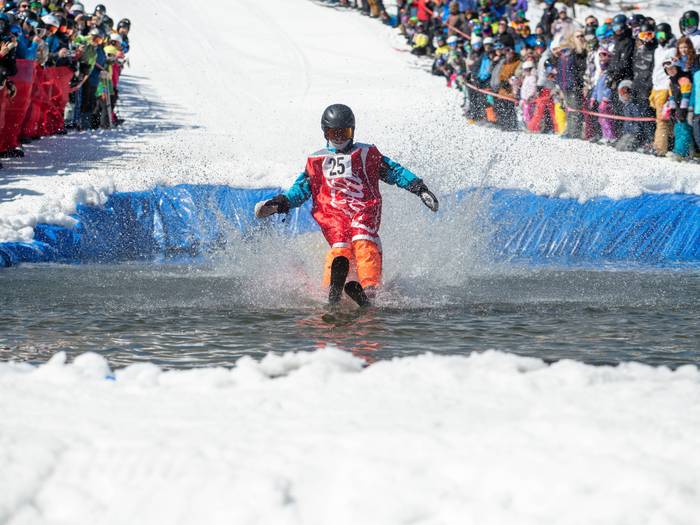 Skier in a Coca-Cola costume during the pond skim.