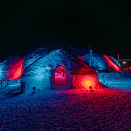 The Igloo at Sunday River with colorful lights at night.