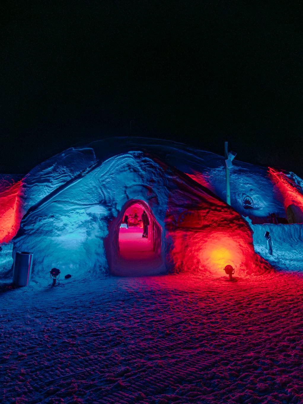 The Igloo at Sunday River with colorful lights at night.