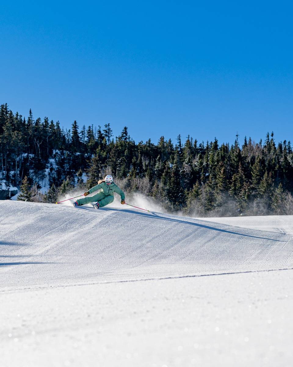 Skier on Northern Lights carving a turn.
