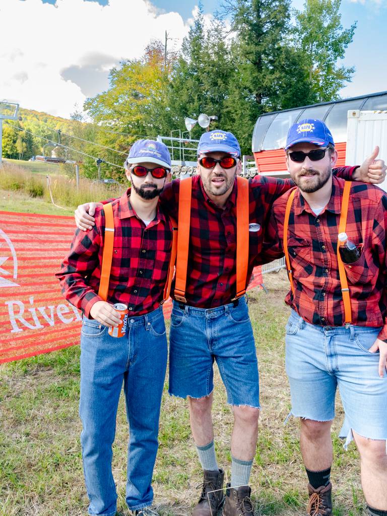 Three men dressed as Donny Pelletier at Sunday River's Flannel fest.