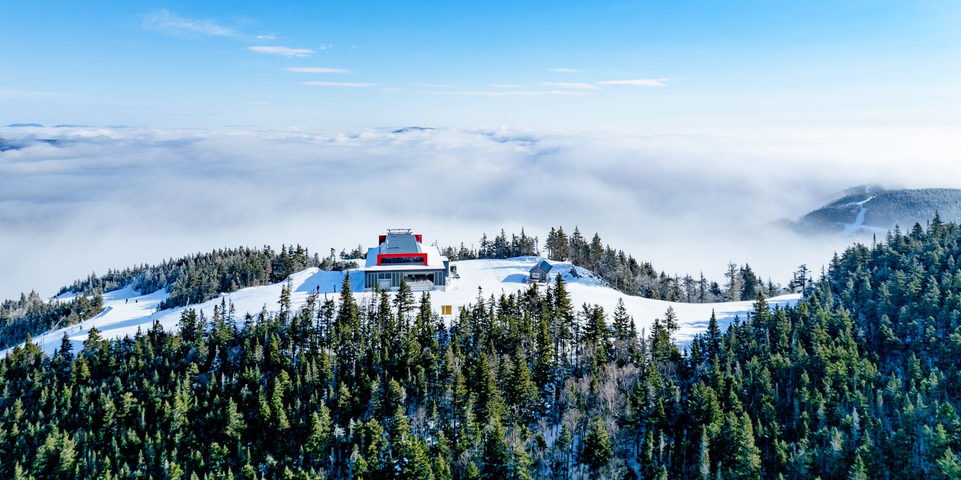 Low clouds around the Jordan 8 chairlift at Sunday River in the winter time.