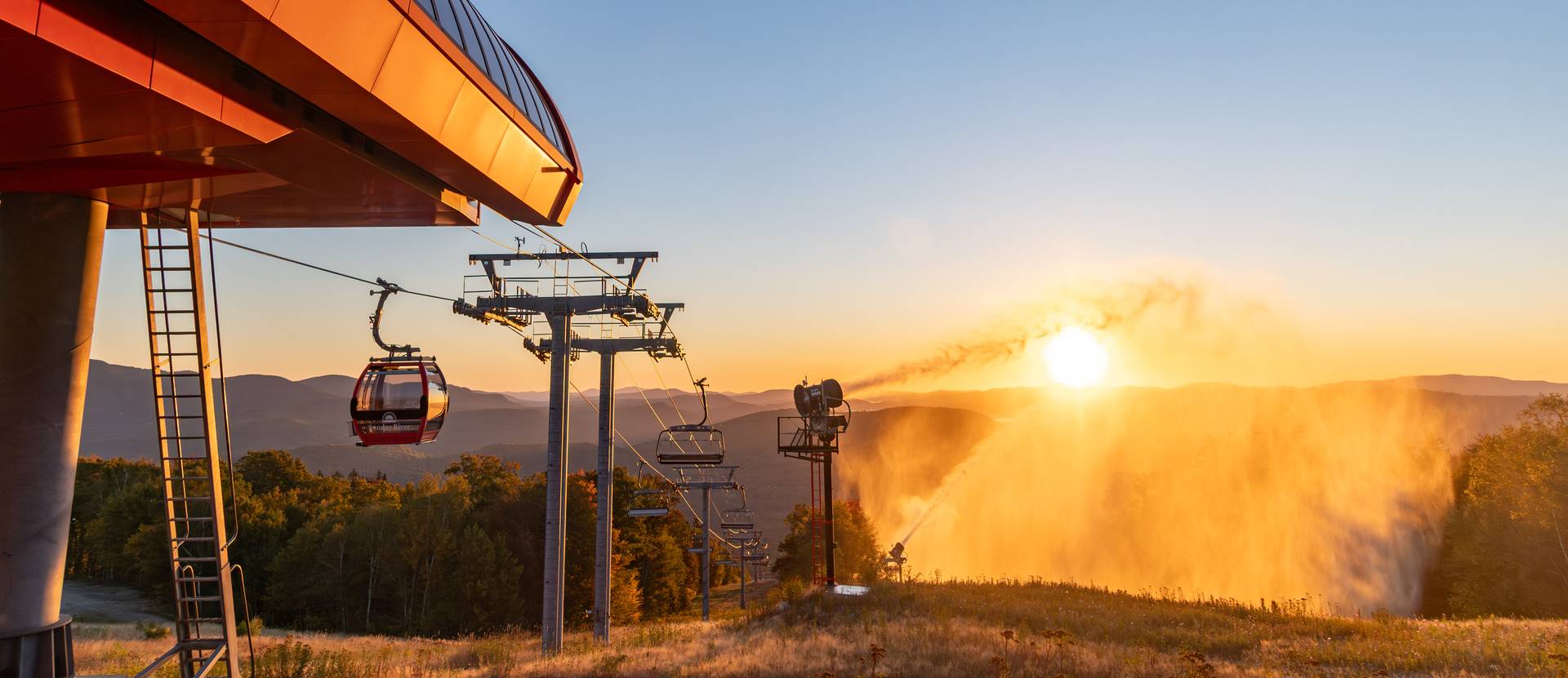 Snowmaking at sunrise at Sunday River in the fall.
