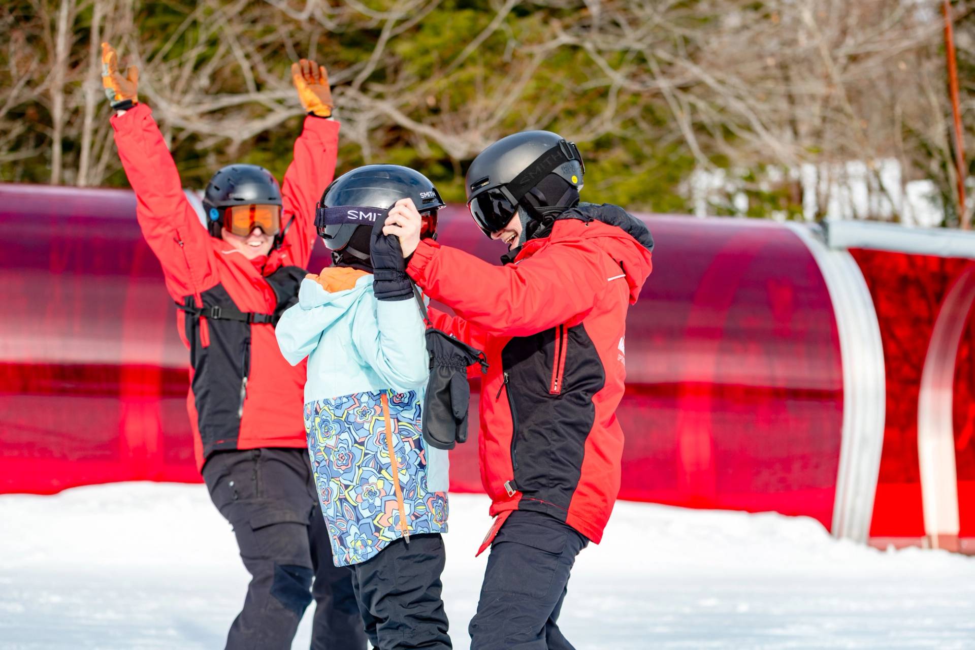 A skier with two Maine Adaptive instructors.