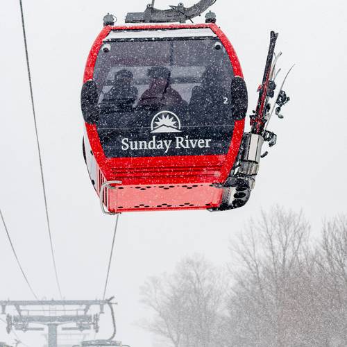 The Chondola with skiers in a cabin at Sunday River.