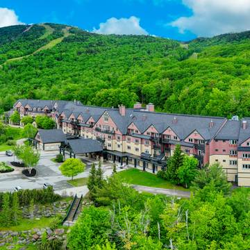 The Jordan Hotel with green trees in the background.
