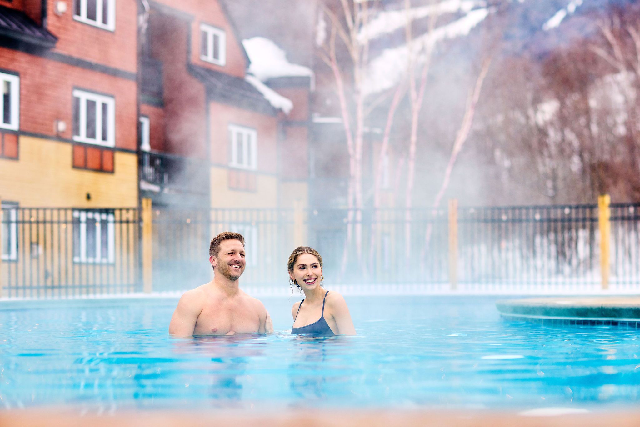 A couple in a hot tub in the winter at Sunday River.