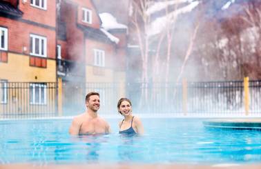A couple in a hot tub in the winter at Sunday River.