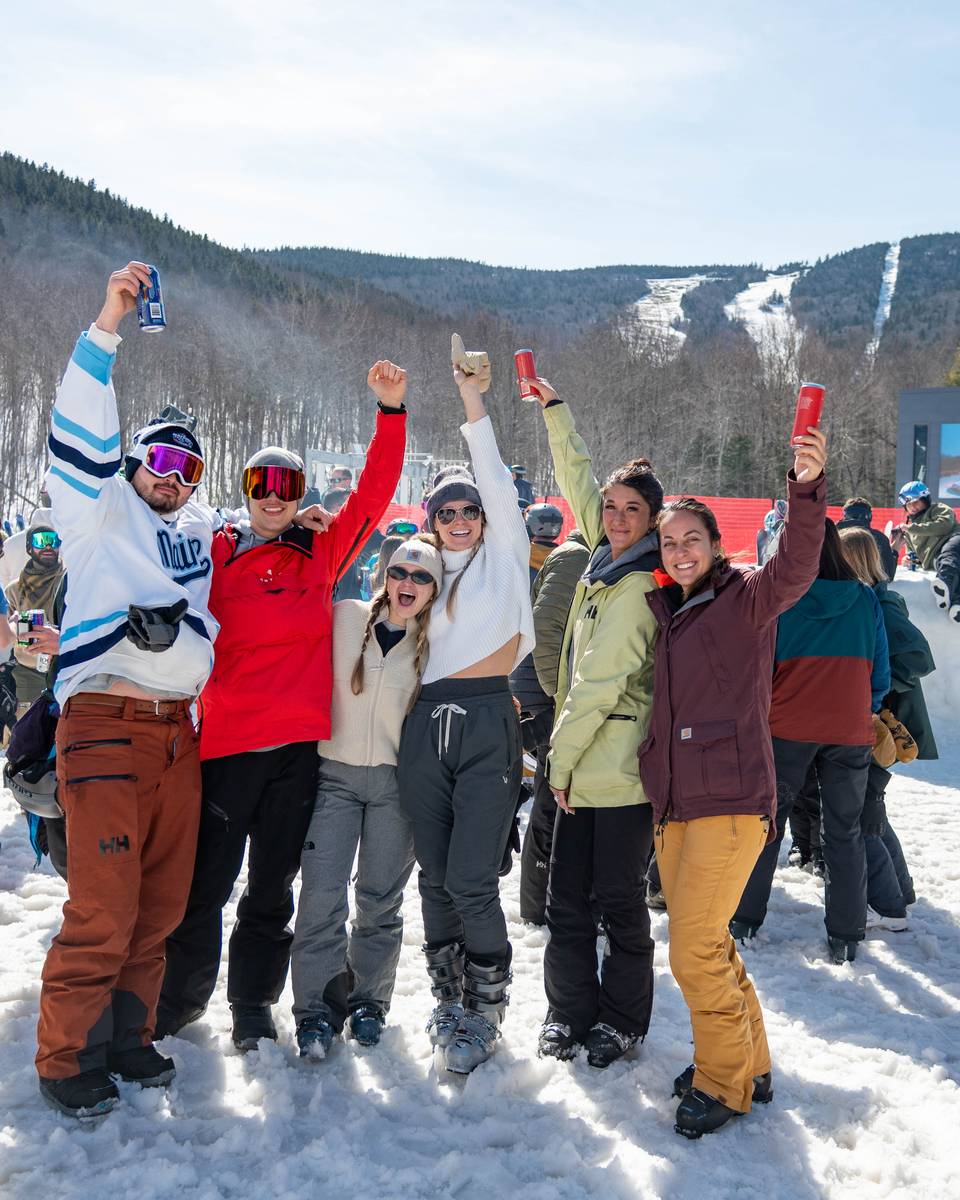 People posing for a picture at the Iglu.